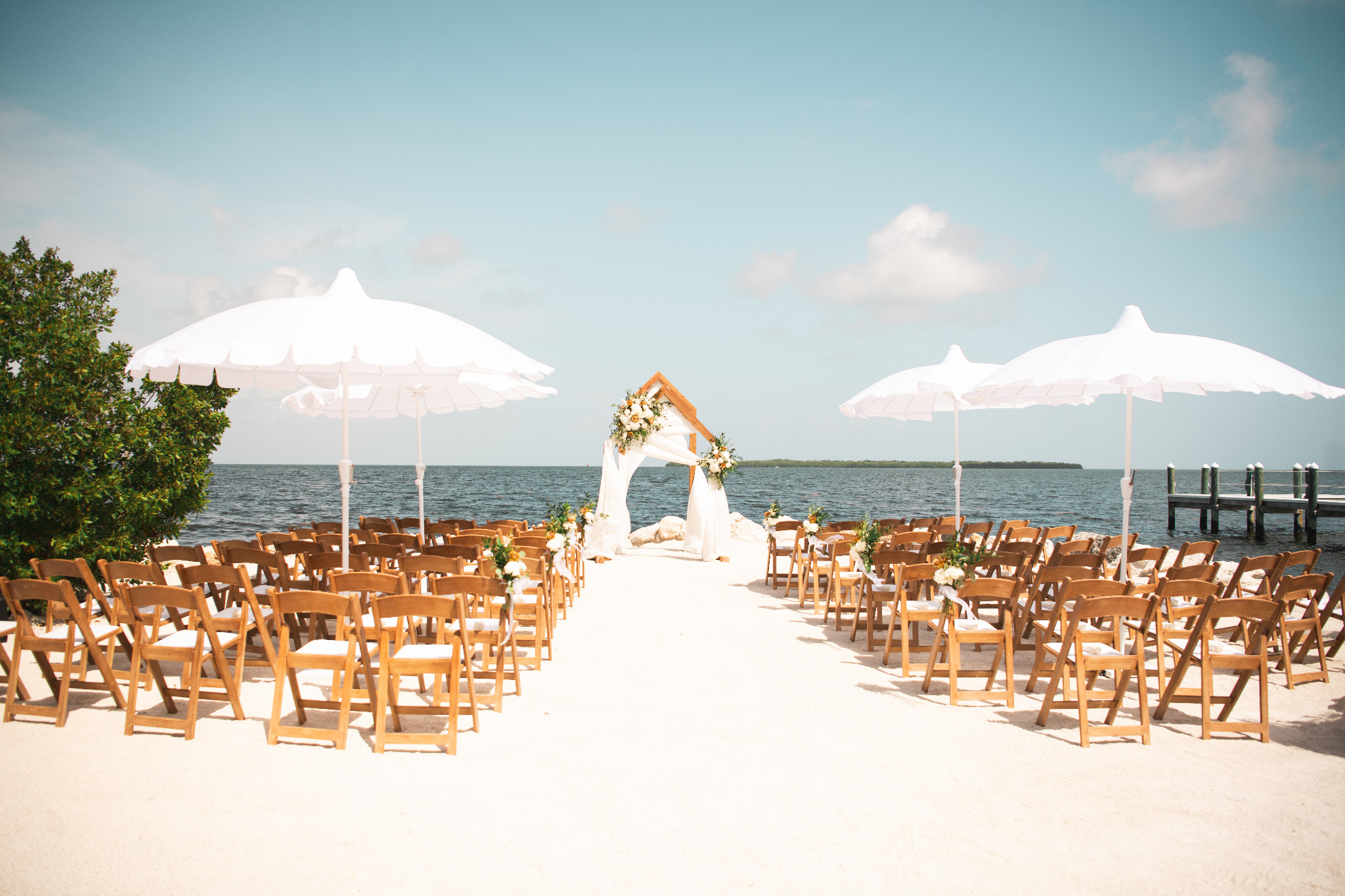 Waterfront ceremony featuring Cart Haus pieces
